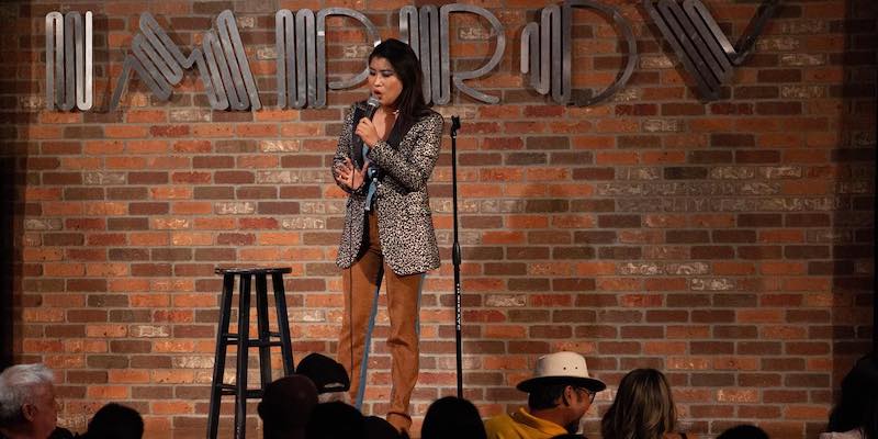 What is the difference between improv and stand-up comedy